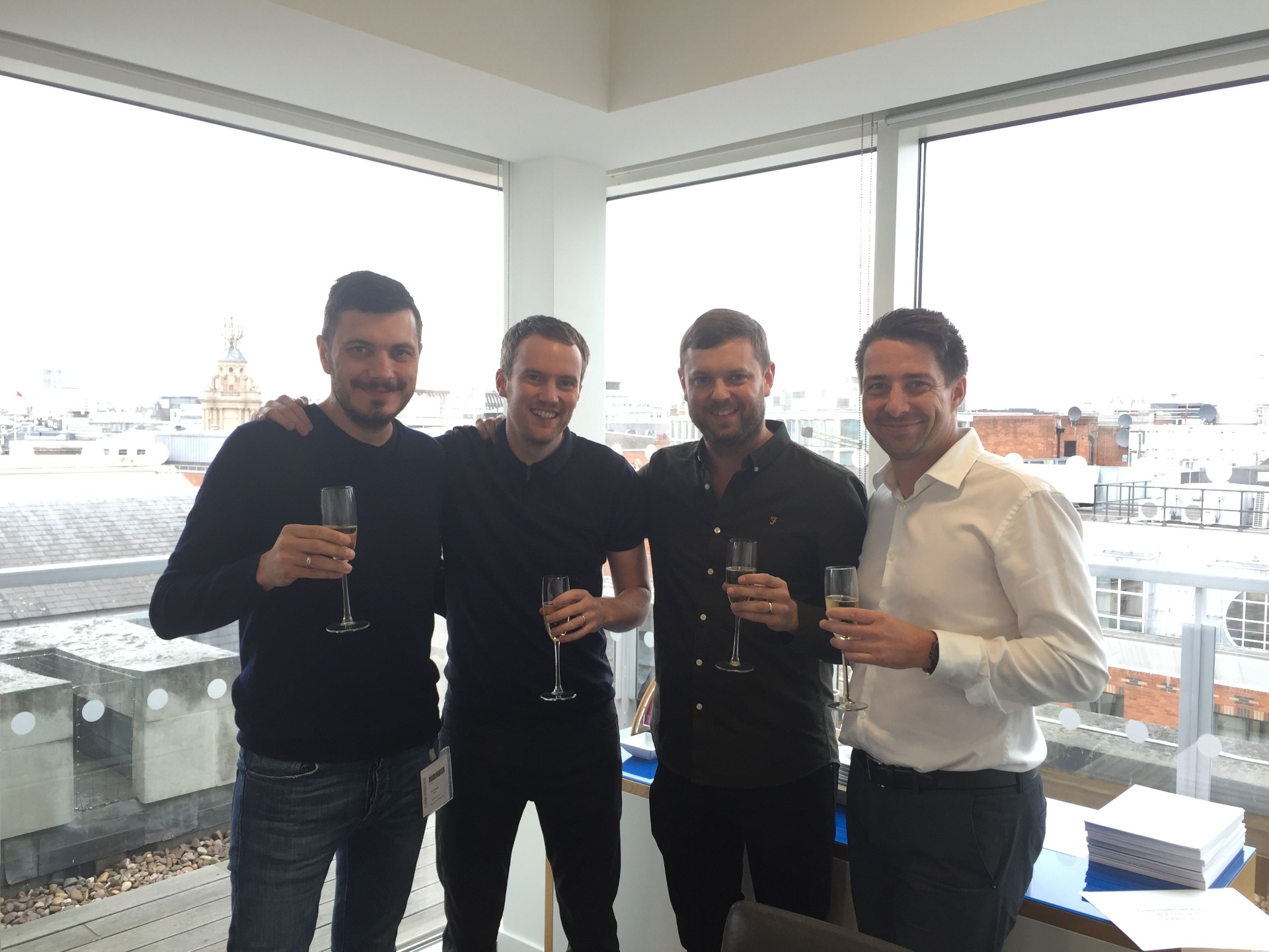 The four 4Ps Marketing founders toasting the sale to Artefact SA